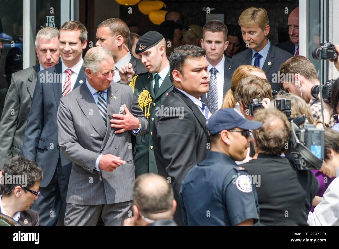 Prince Charles and the Premier of Ontario Dalton McGuinty leave Ryerson University. The visit was part of the Queen's Diamond Jubilee celebrations. Stock Photo