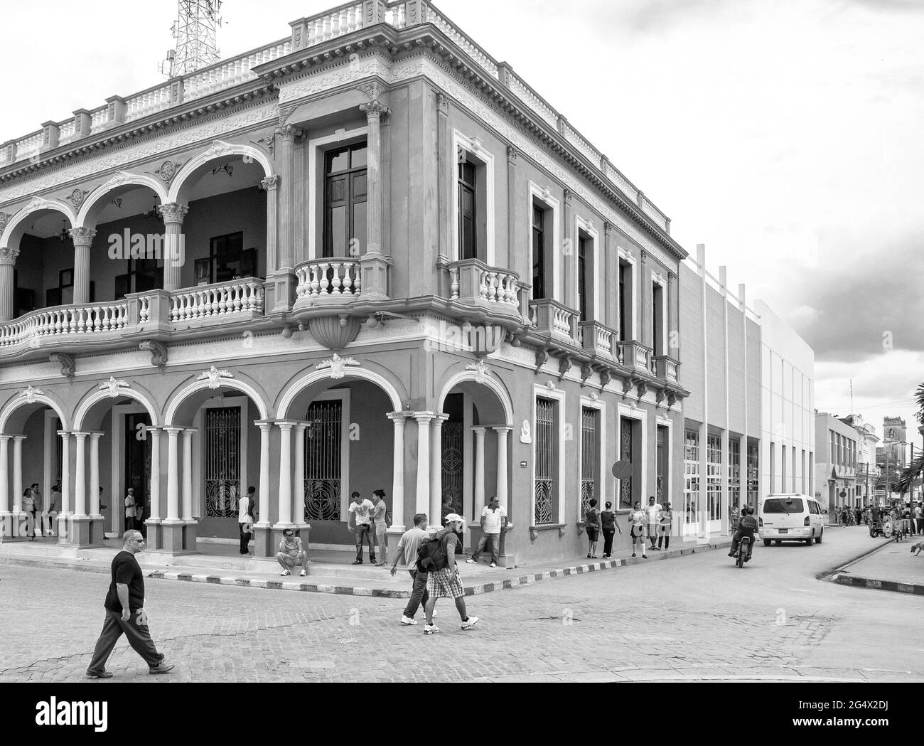 Historic old vintage colonial building in the Leoncio Vidal plaza which is a Cuban National Monument.  The building features the only semicircular bal Stock Photo