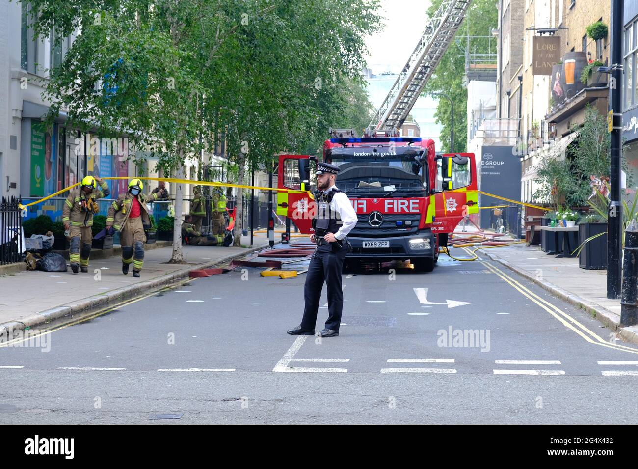 The emergency services attend the scene of a fire at the Lore of the Land pub in Fitzrovia, owned by film director Guy Ritchie. Stock Photo