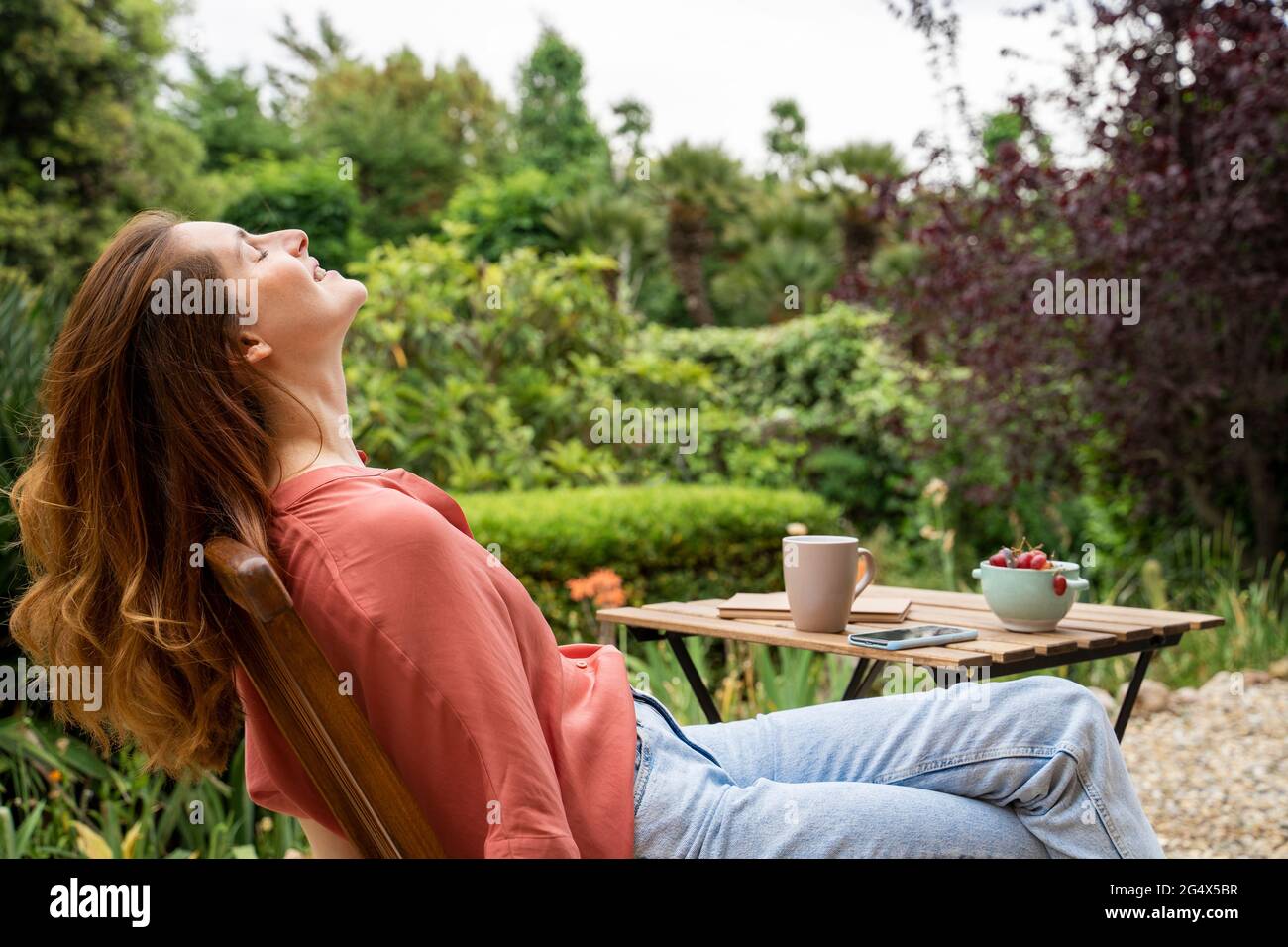 One woman sitting chair eyes closed hi-res stock photography and images ...