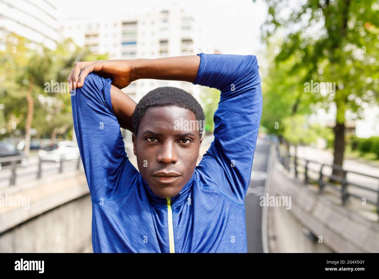 Man stretching arms hi-res stock photography and images - Alamy