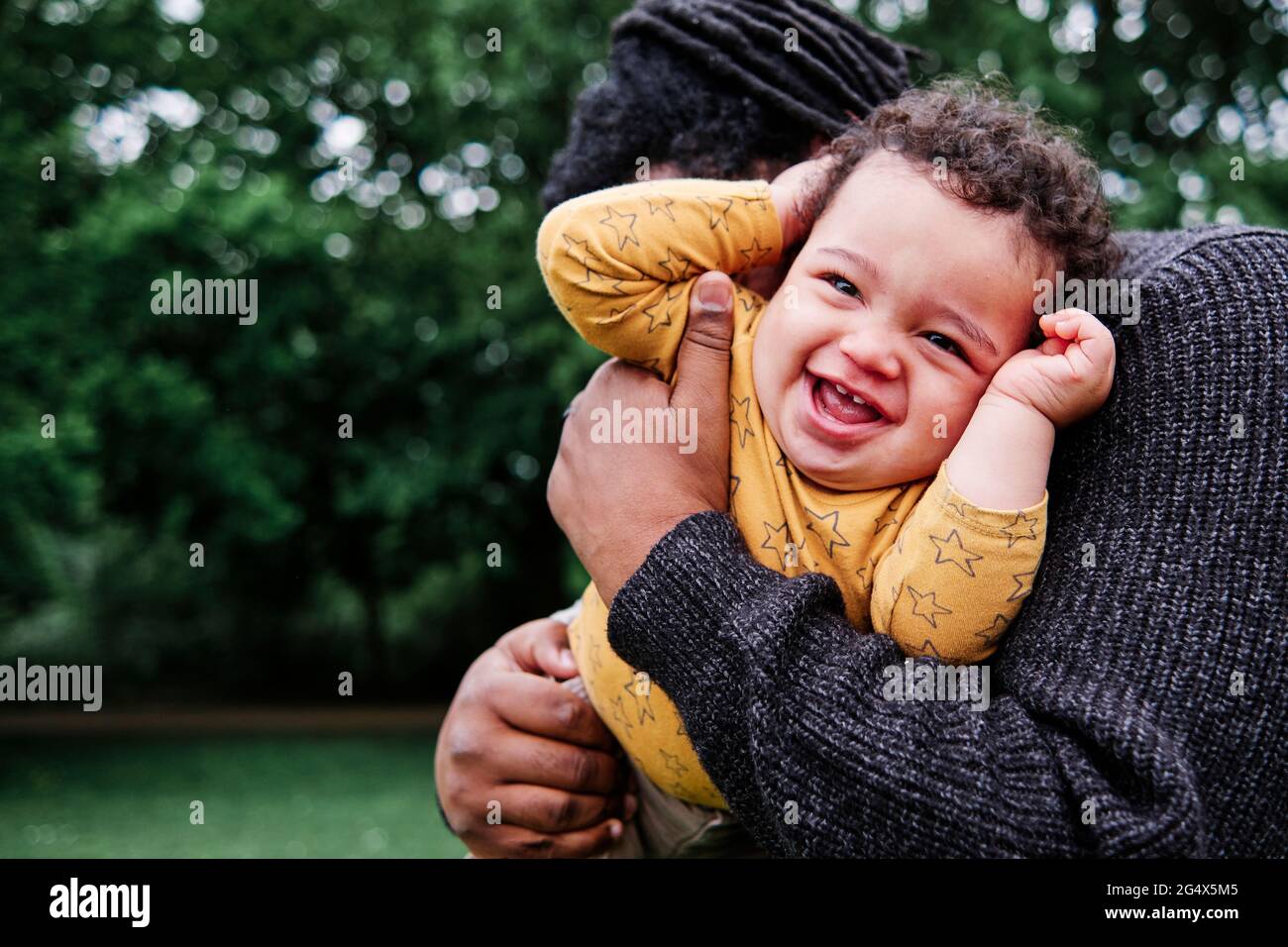 Cheerful son playing father hi-res stock photography and images - Alamy