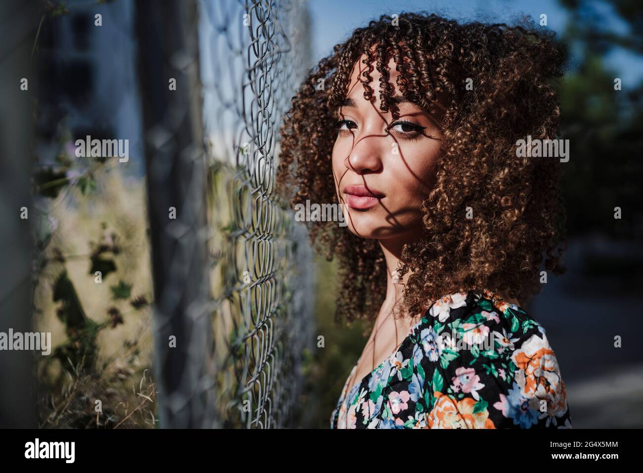 Beautiful young curly woman hi-res stock photography and images - Alamy