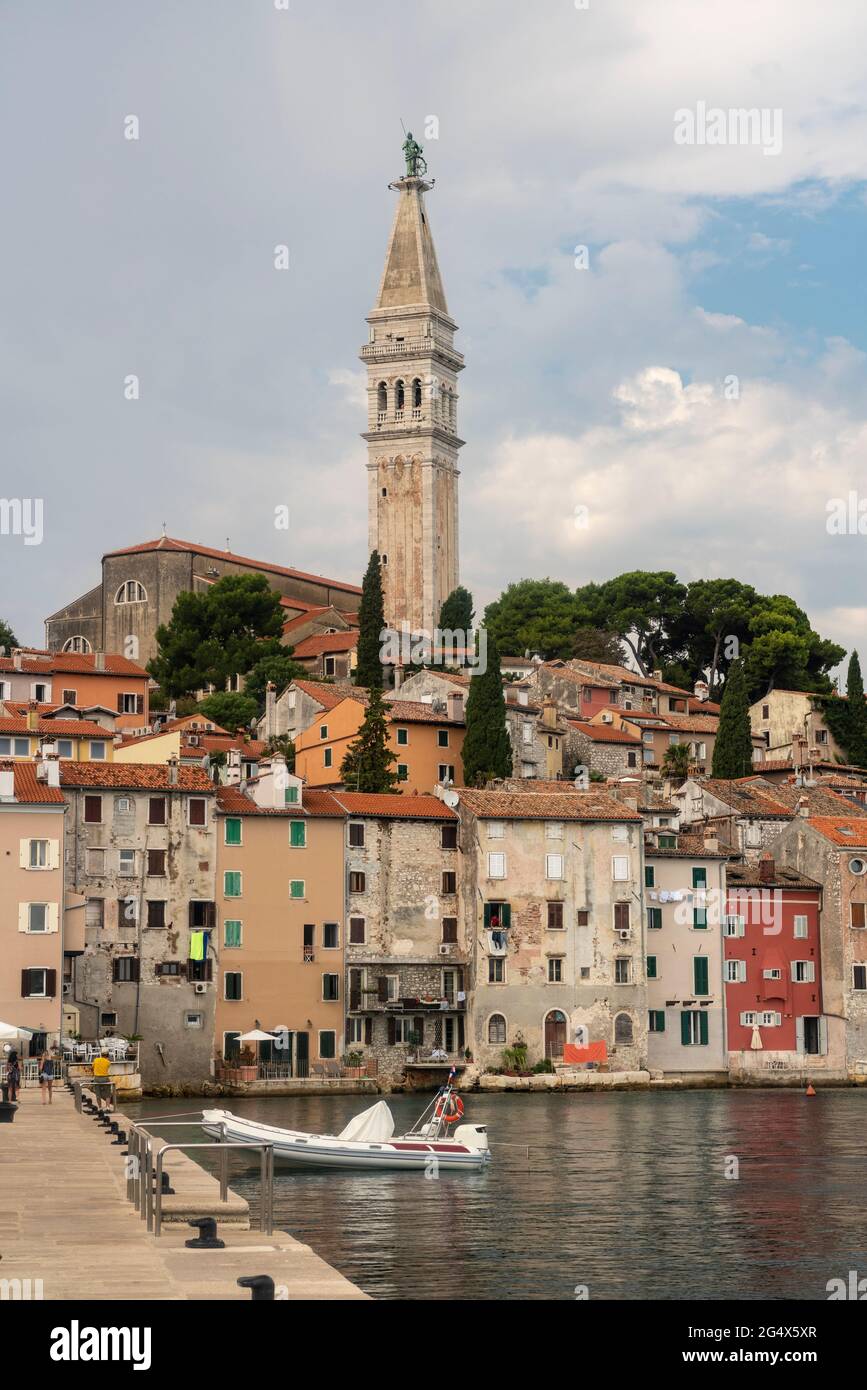 Croatia, Istria County, Rovinj, Harbor of coastal city in summer with tall bell tower of Church of Saint Euphemia in background Stock Photo