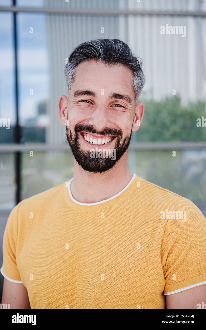 Mid adult bearded man smiling Stock Photo