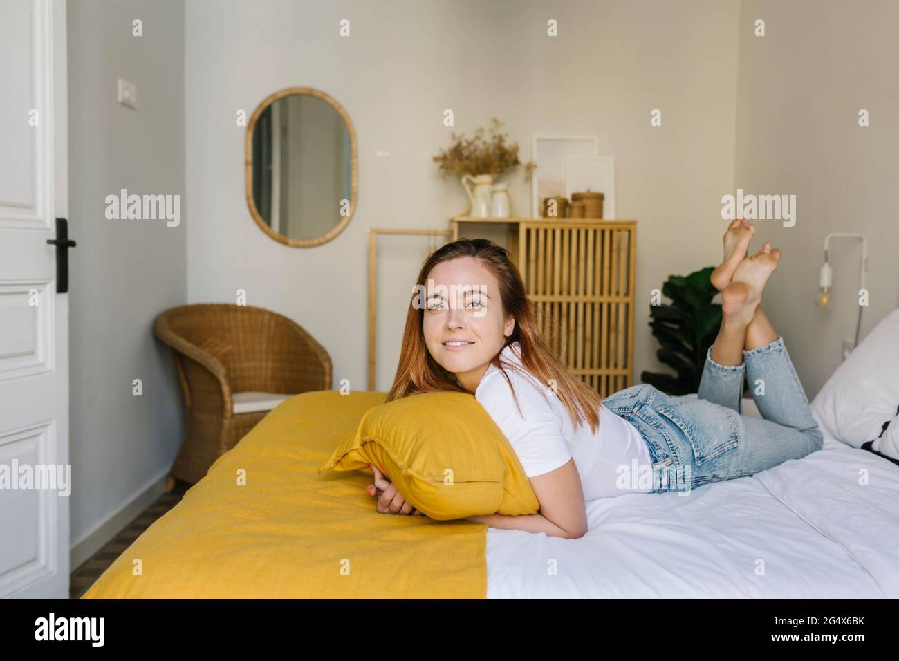 Woman lying on bed legs hi-res stock photography and images - Alamy