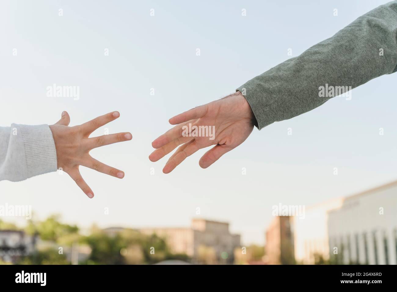 Two hands raised up Stock Photo by ©Toberto 72621765