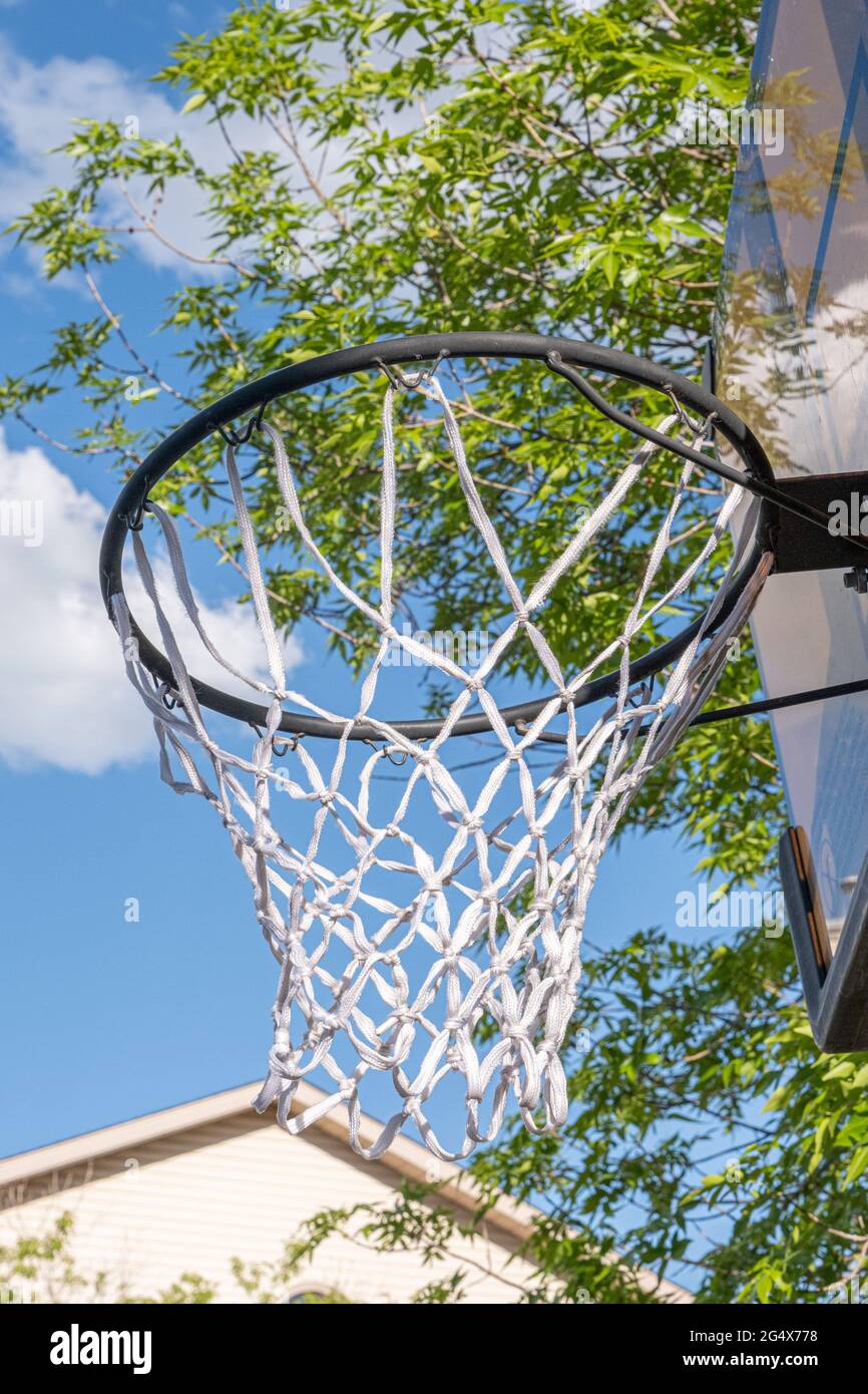 Basketball hoop outside in summer on driveway Stock Photo Alamy