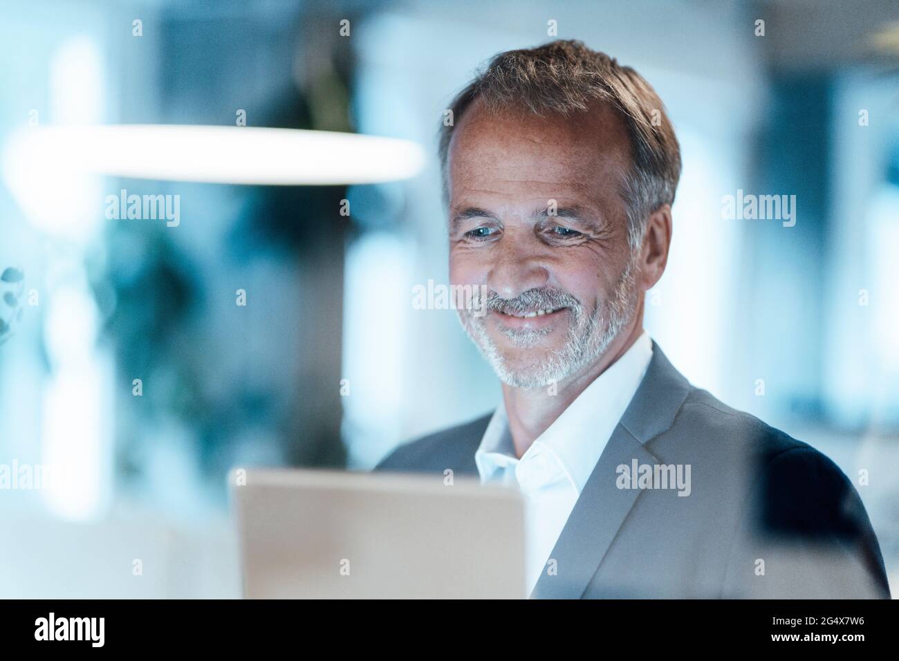 Senior businessman using digital tablet in office Stock Photo