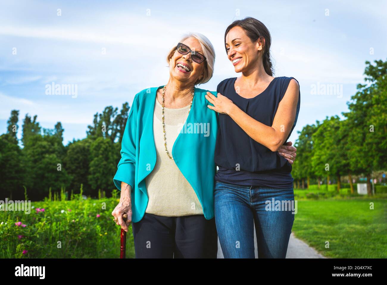 Happy women walking hi-res stock photography and images - Alamy
