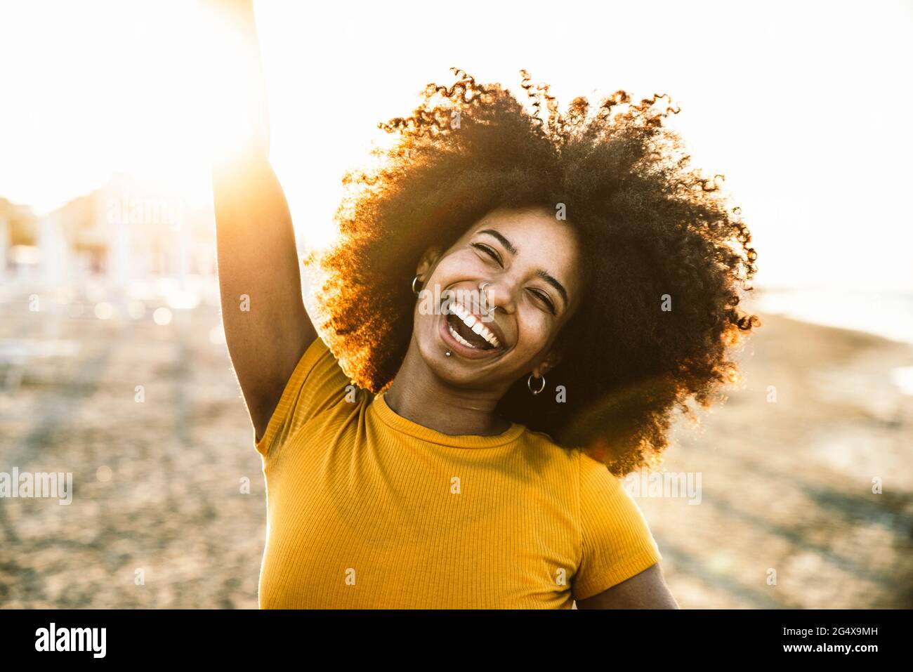 Woman enjoying the beach hi-res stock photography and images - Alamy