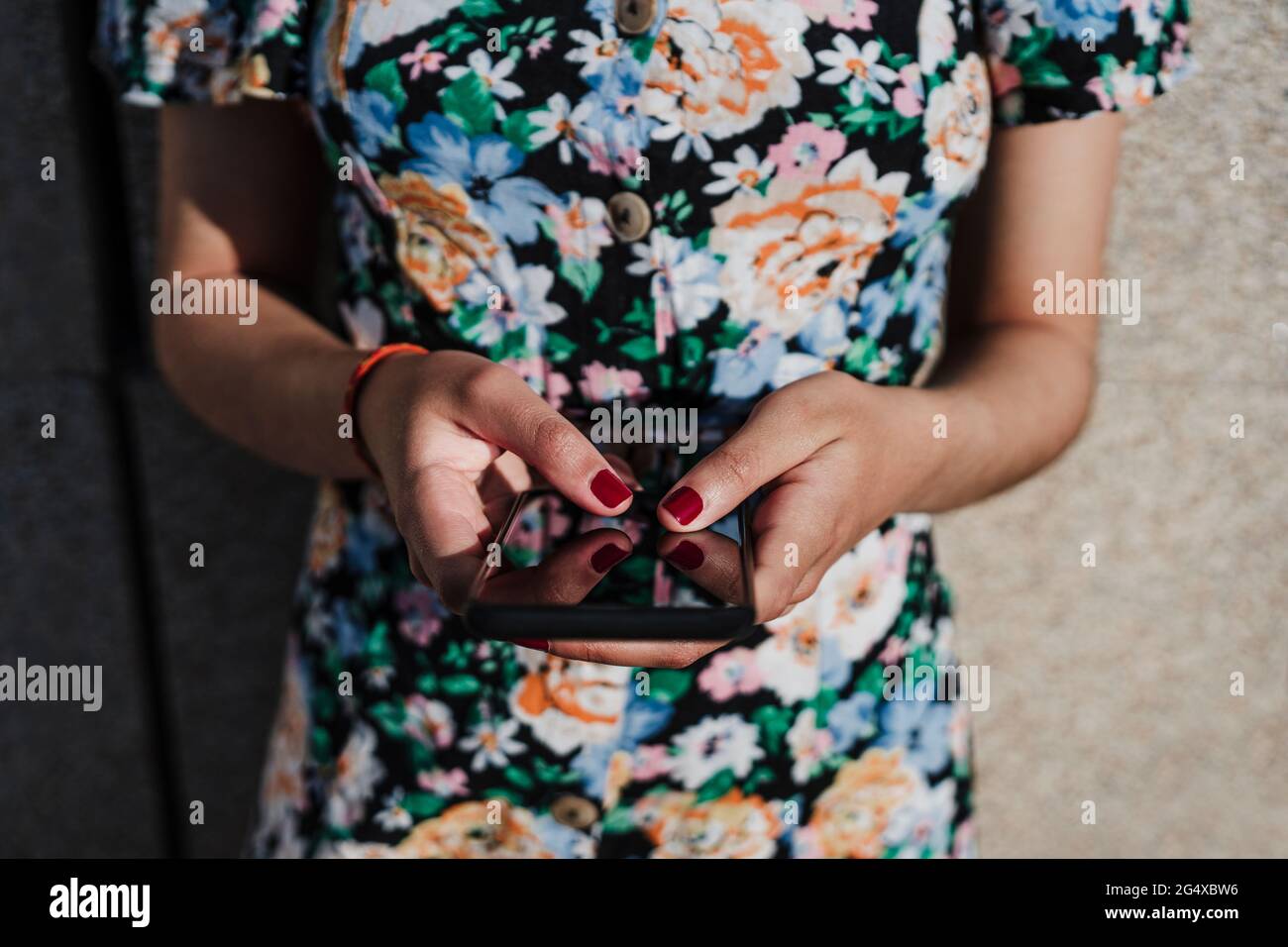 Young woman holding smart phone Stock Photo
