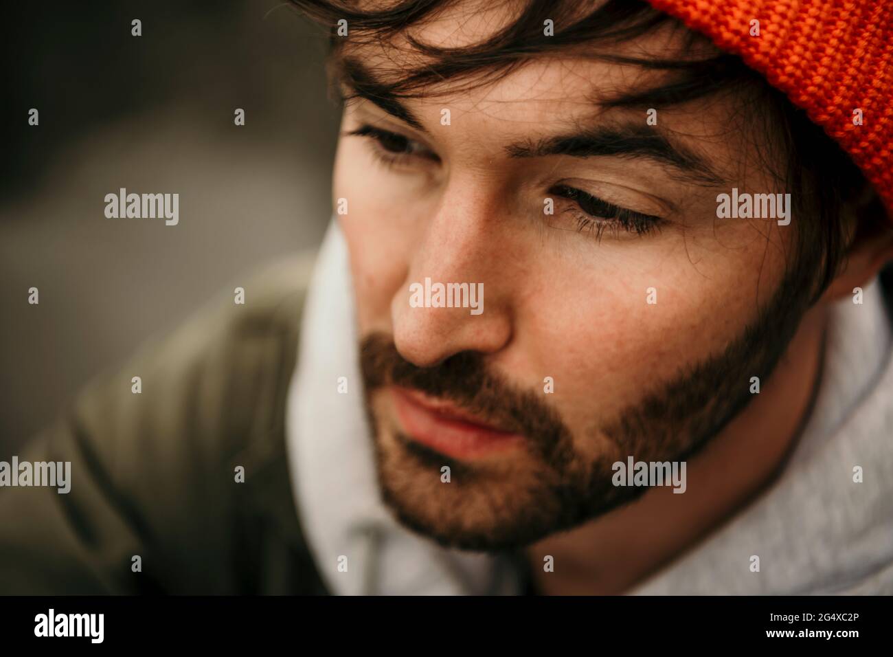 Thoughtful bearded man looking away Stock Photo