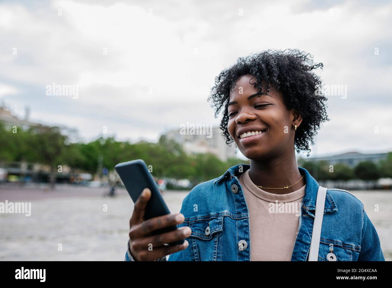 African american woman smiling using hi-res stock photography and ...