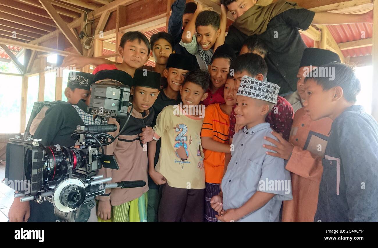 group of asian kids watching video from camera Stock Photo