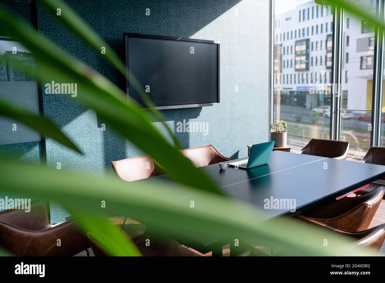 Television set and laptop at board room in office Stock Photo - Alamy