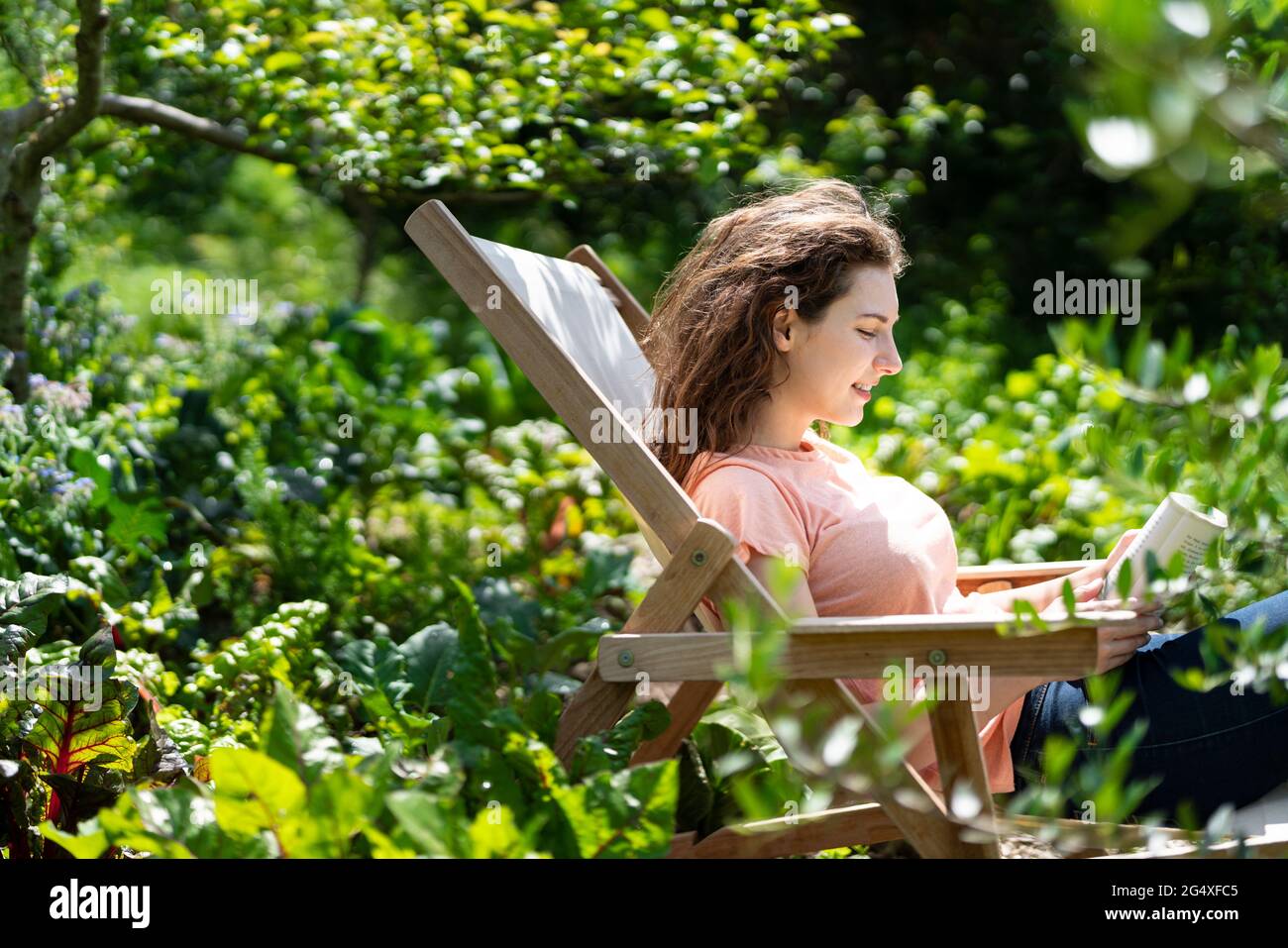 Woman sitting chair side view hi-res stock photography and images - Alamy