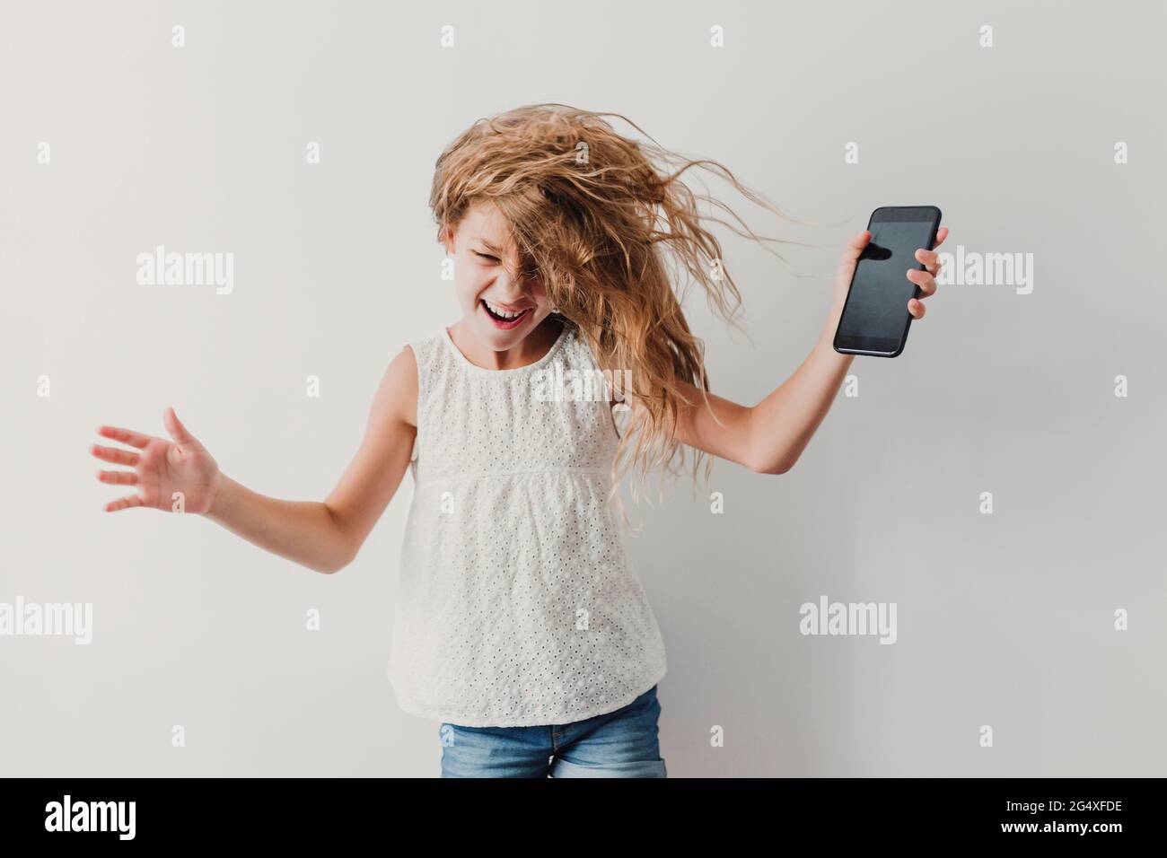 Cheerful girl with tousled hair Stock Photo