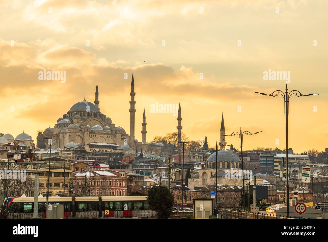 Turkey, Istanbul, Moody sky over Fatih district at sunset with Suleymaniye and Rustem Pasha mosques in background Stock Photo