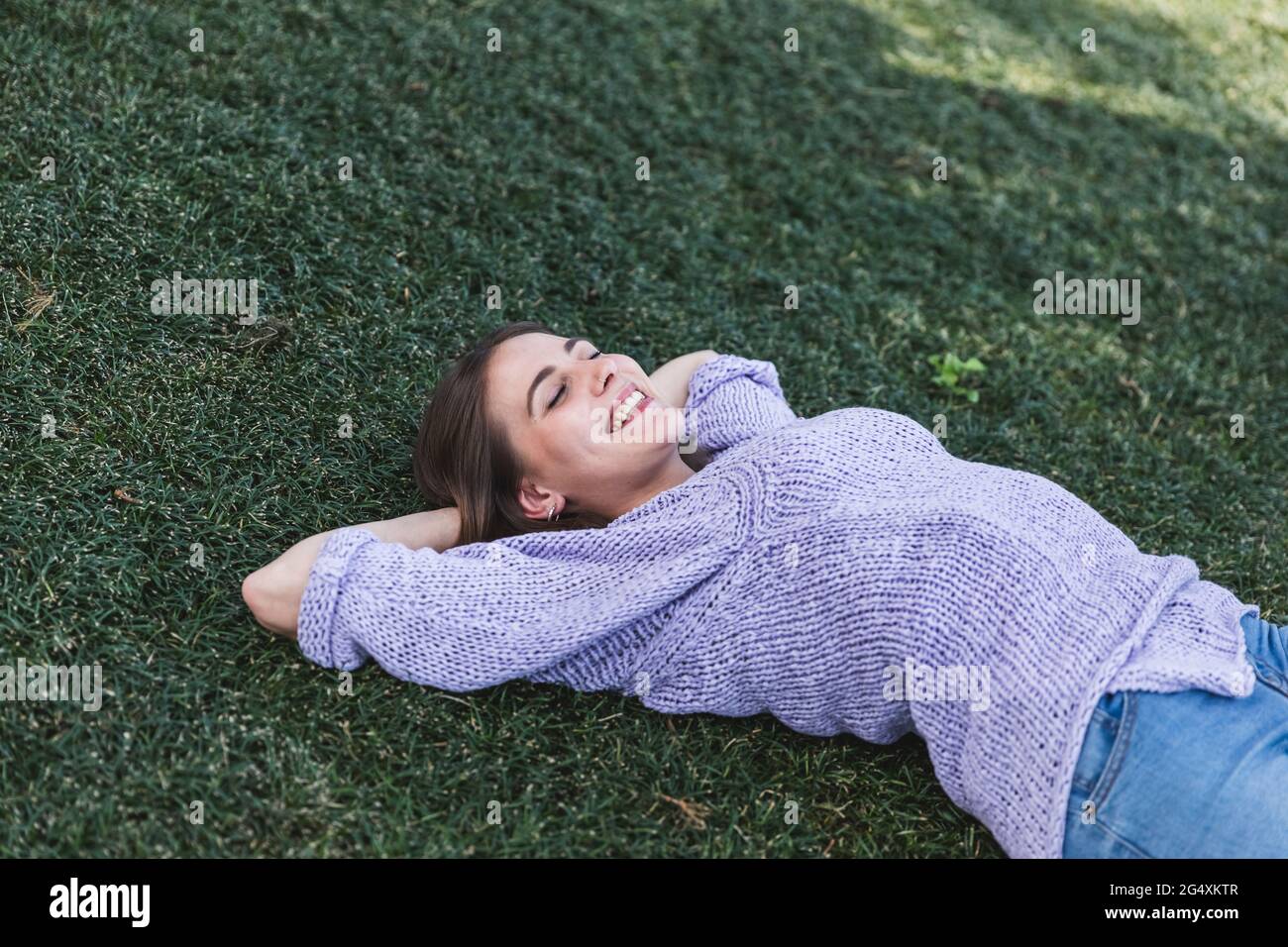 Woman relaxing in park on hi-res stock photography and images - Alamy