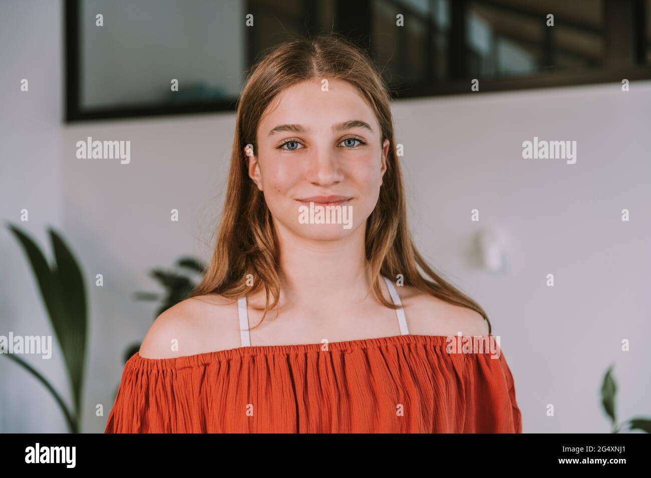 Teenage girl smiling at home Stock Photo