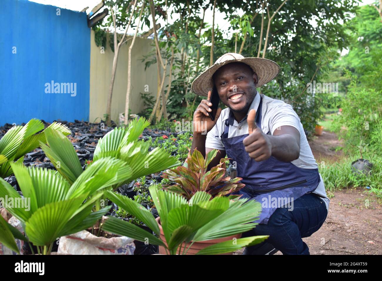 an african farmer making a phone call Stock Photo