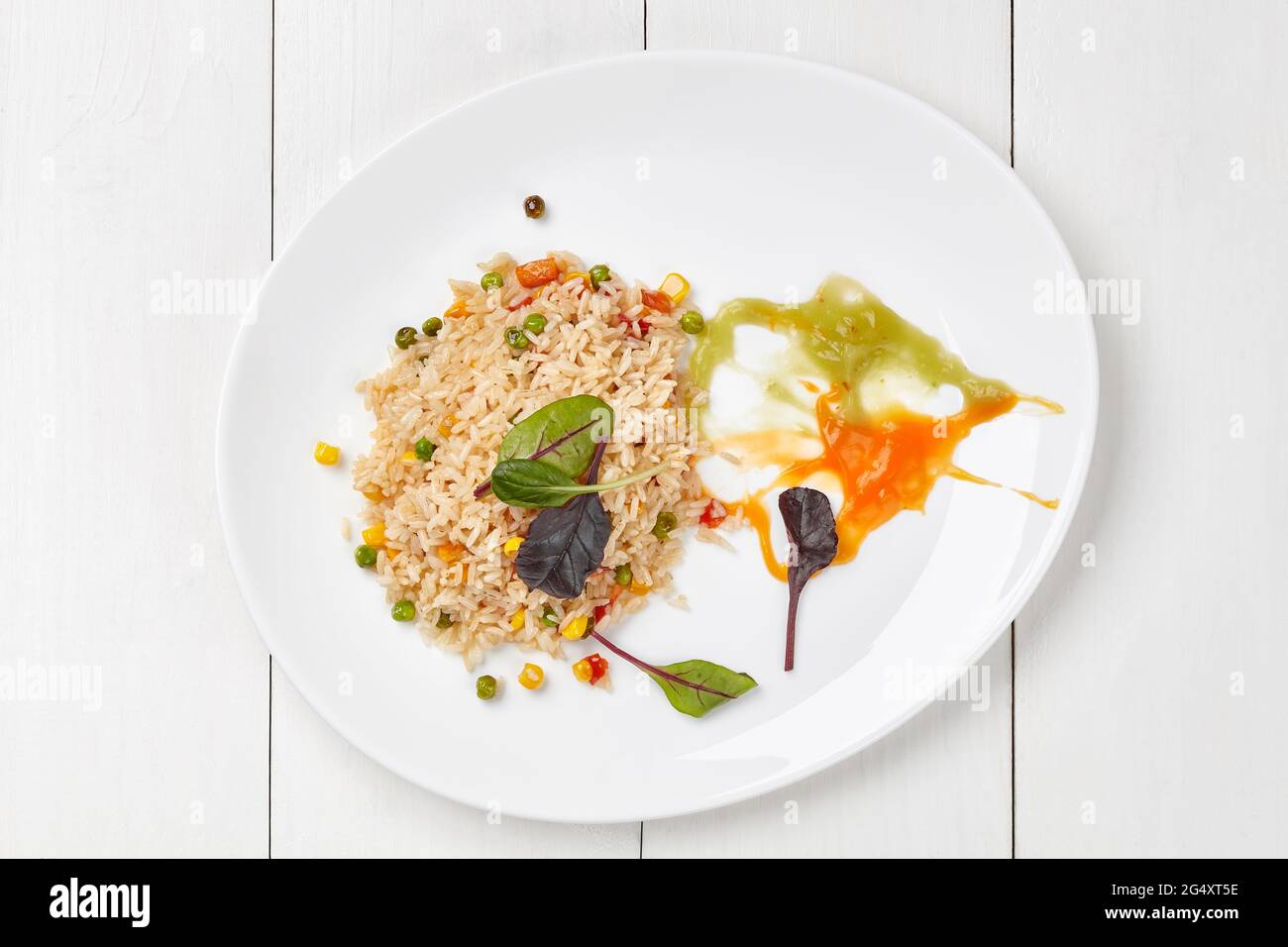 Vegetable rice with carrot and celery puree Stock Photo Alamy