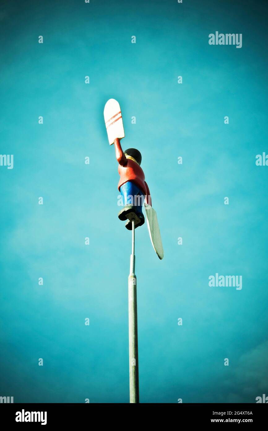 a weather vane in human shape Stock Photo Alamy