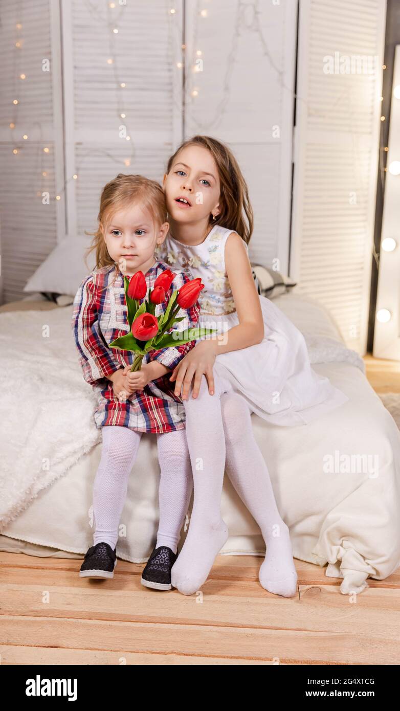 Two cute little girls are hugging. Friendship sisters. Stock Photo