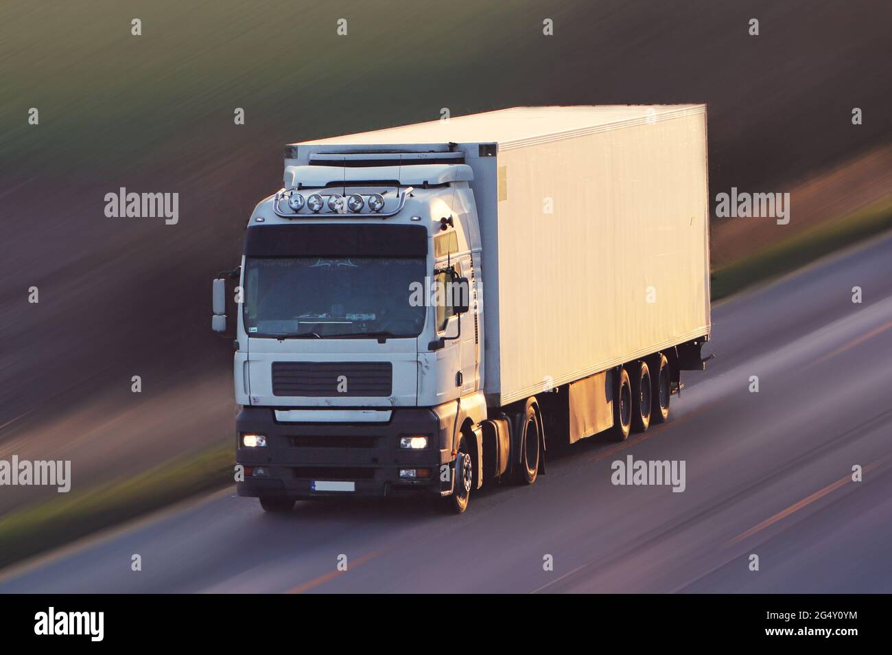 Truck cargo with lift parking at warehouse, road freight delivery logistics and transport. Stock Photo