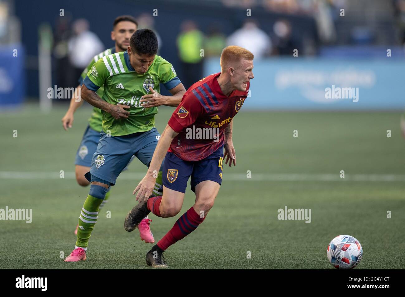 Seattle Sounders forward Raul Ruidiaz (9) reacts to an accidental shot to the face from Real Salt Lake defender Justen Glad (15) during the first half Stock Photo