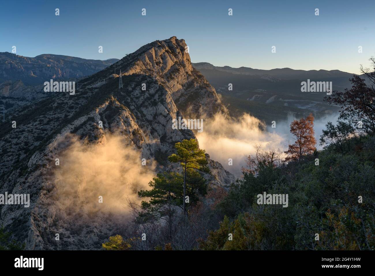 Grau d'Oliana Gorge, seen from the hermitage of Castell-llebre in a foggy winter sunrise (Alt Urgell, Catalonia, Spain, Pyrenees) Stock Photo