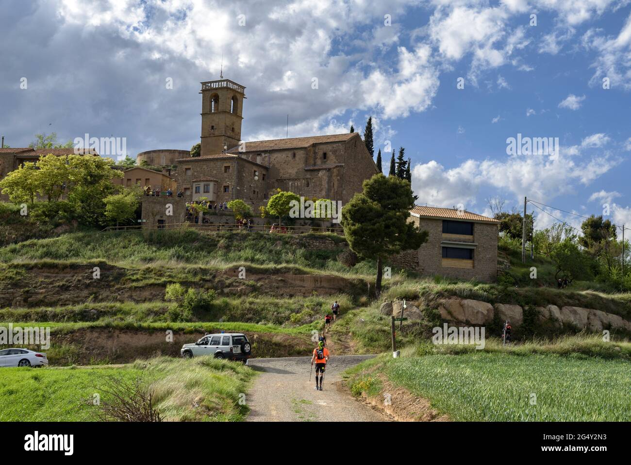 Runners doing the Romànica race, a long-distance GR trail that passes through more than 20 Romanesque hermitages in central Catalonia, Barcelona Spain Stock Photo