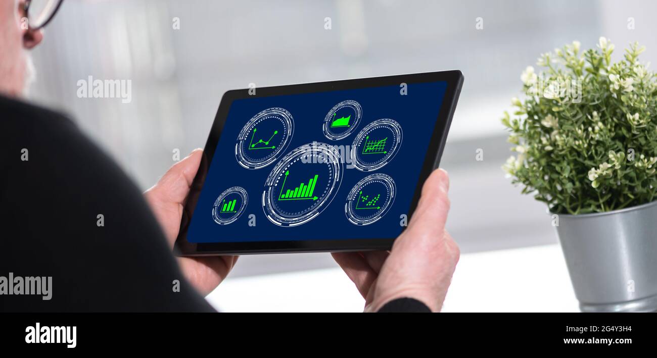 Tablet screen displaying a graphical analysis concept Stock Photo Alamy