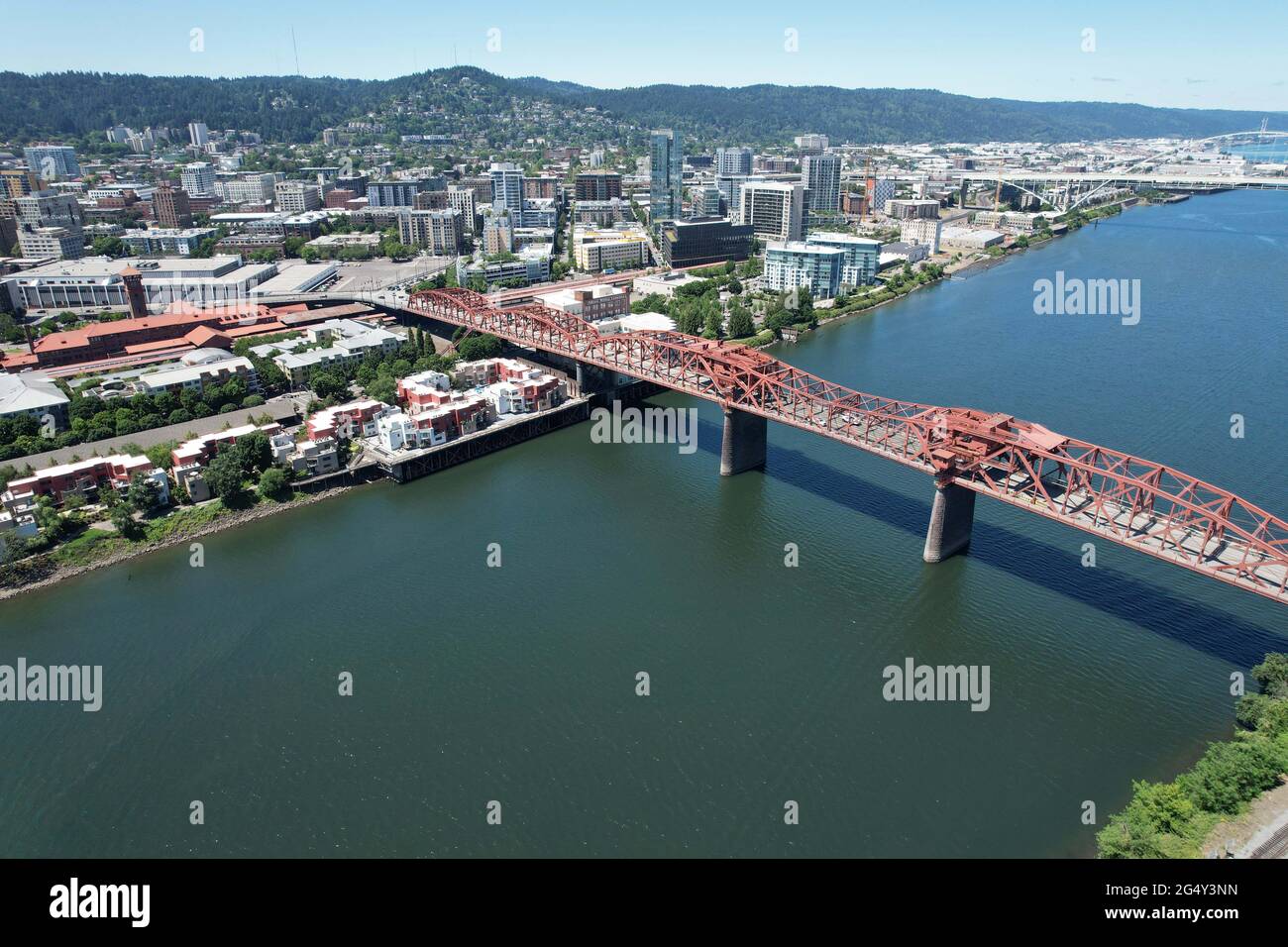 An aerial view of the Broadway Bridge and the Freemont Bridge over the Williamette River with the downtown Portland, Ore. skyline as a backdrop, Wedne Stock Photo