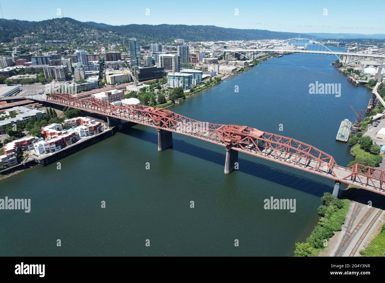 An aerial view of the Broadway Bridge and the Freemont Bridge over the Williamette River with the downtown Portland, Ore. skyline as a backdrop, Wedne Stock Photo