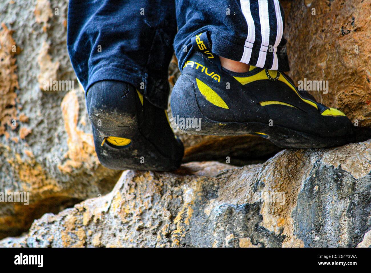 climbing. climber shoes hovering on the rock Stock Photo Alamy