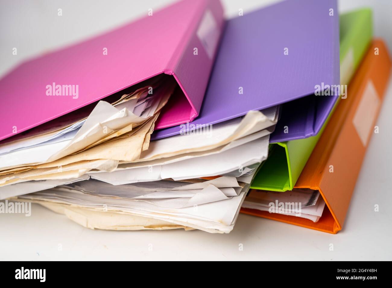 File Folder Binder stack of multi color on table in office Stock Photo -  Alamy