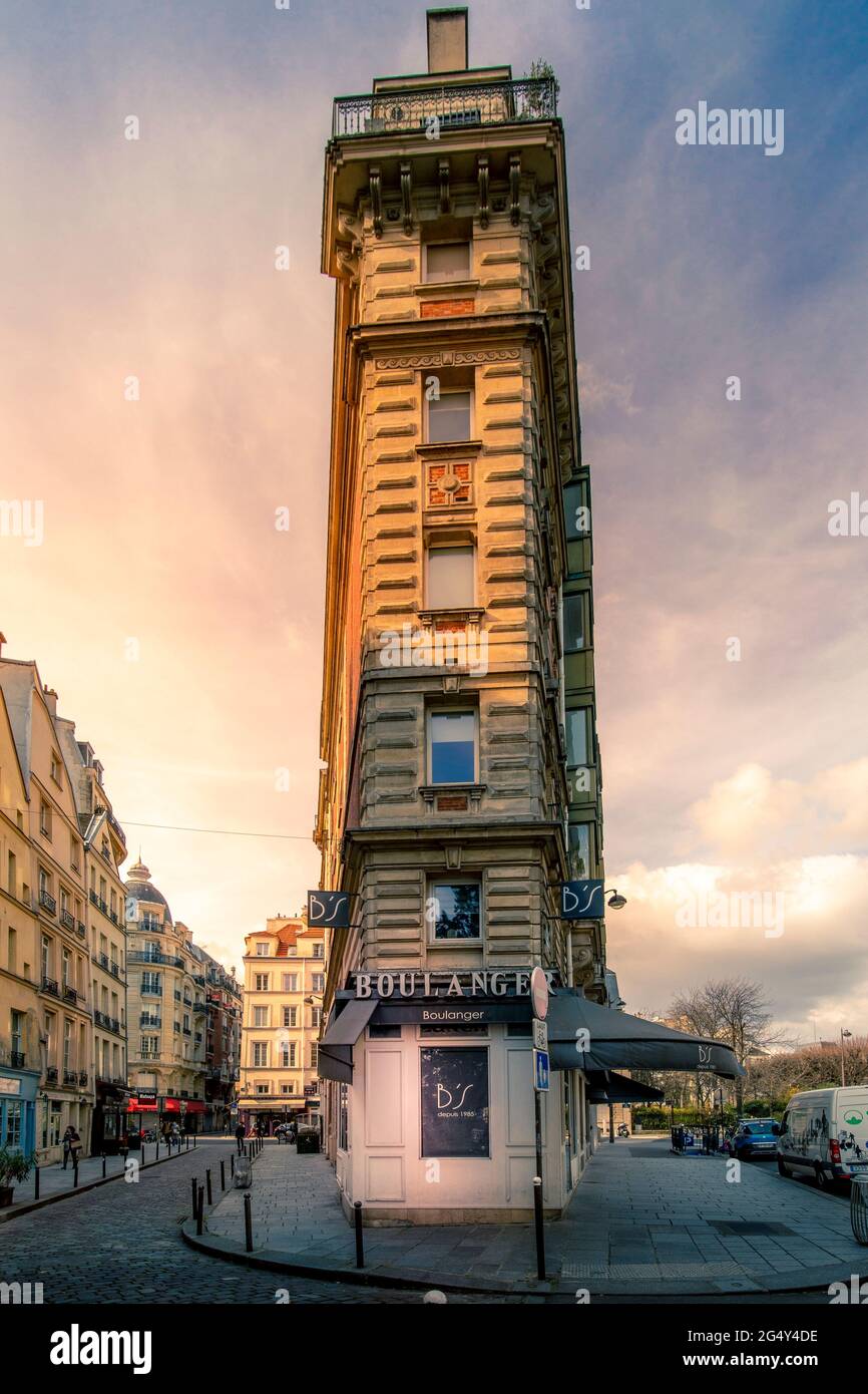 Paris, France - March 21, 2021: Facades of apartment buildings with nice pink sky in Paris, France Stock Photo