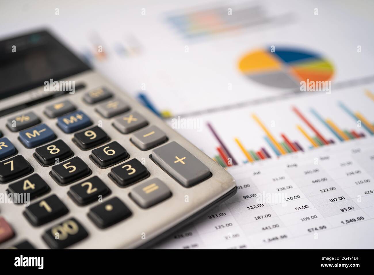 Calculator on chart and graph paper. Finance, Account, Statistics, Analytic  research data and Business company meeting concept Stock Photo - Alamy
