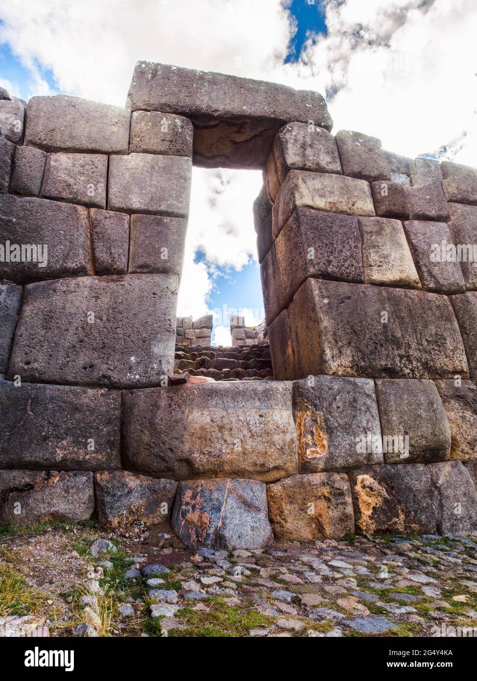 Large polished dry stone walls of the Saksaywaman military Inca complex - Cusco, Peru Stock Photo