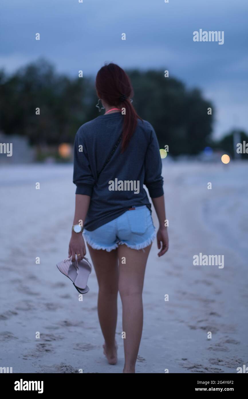 Woman walking barefoot street hi-res stock photography and images - Alamy