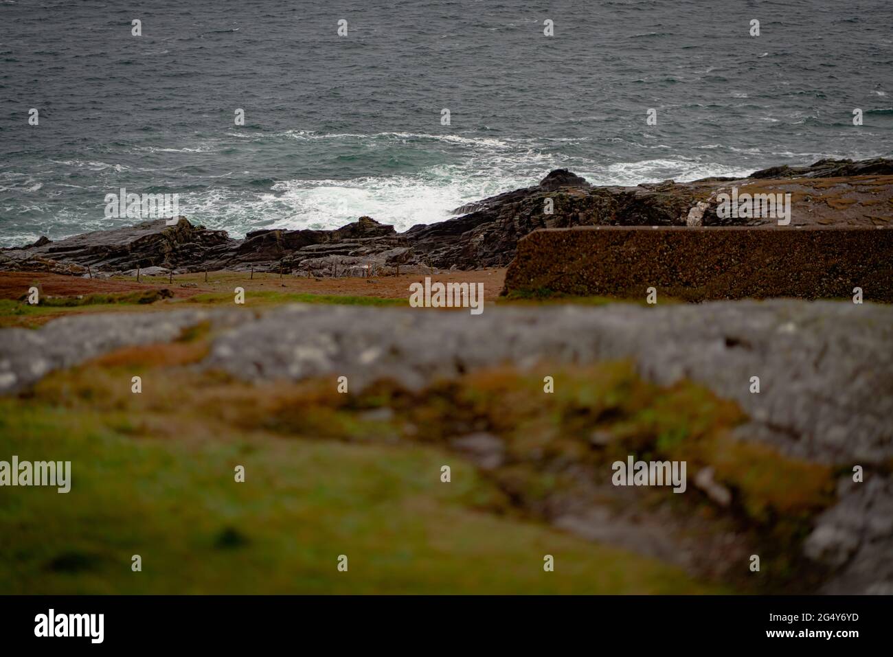 Waves hitting a rocky seashore Stock Photo - Alamy
