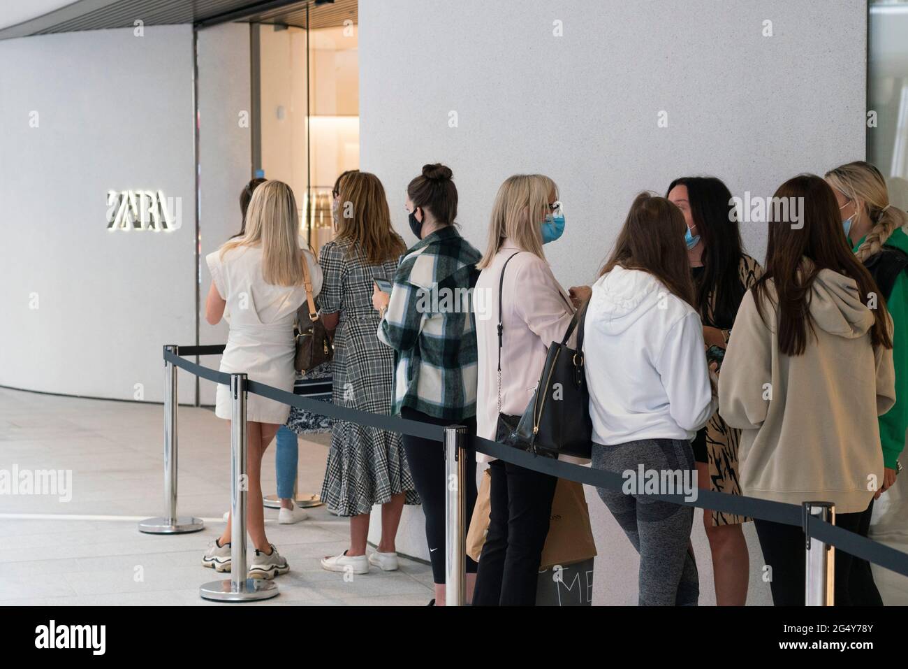 Edinburgh, Scotland, UK. 24 June 2021. First images of the new St James Quarter which opened this morning in Edinburgh. The large retail and residential complex replaced the St James Centre which occupied the site for many years. Pic; Queue of shoppers outside Zara store.  Iain Masterton/Alamy Live News Stock Photo