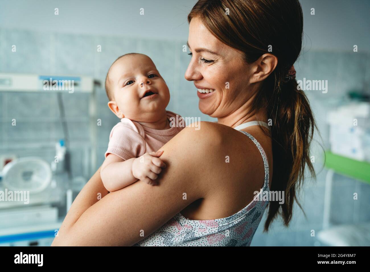 Portrait of beautiful mother with her newborn baby. Stock Photo