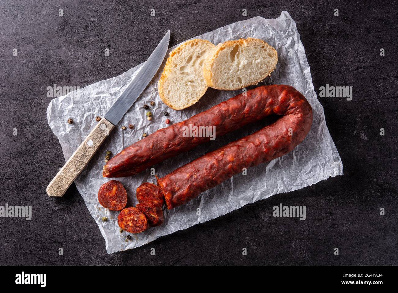 Spanish chorizo sausage on black slate background Stock Photo - Alamy
