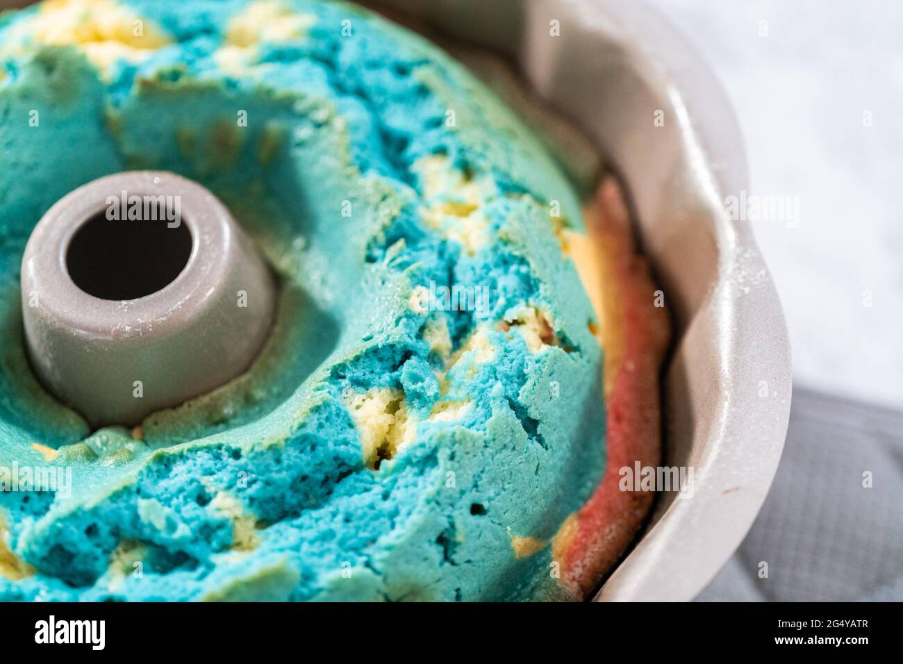 Cooling freshly baked bundt cake in bundt cake pan on the kitchen