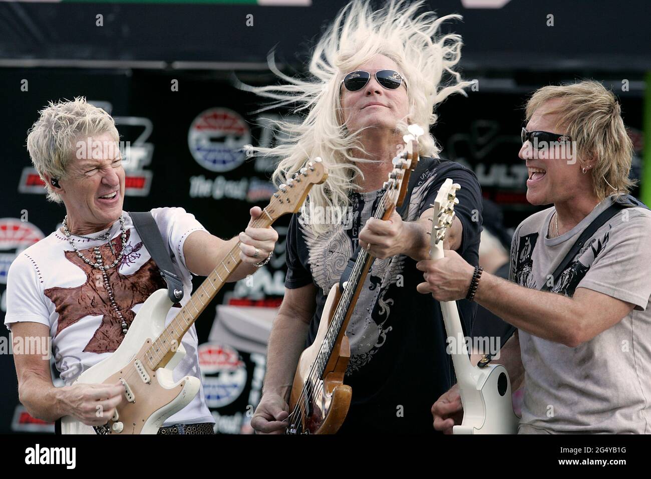 Fort Worth, USA. 02nd Nov, 2008. REO Speedwagon members, from left, Kevin Cronin, Bruce Hall, and Dave Amato perform before the start of the NASCAR Sprint Cup Dickies 500 on Sunday, Nov. 2, 2008, at Texas Motor Speedway in Fort Worth, Texas. (Photo by Ross Hailey/Fort Worth Star-Telegram/TNS/Sipa USA) Credit: Sipa USA/Alamy Live News Stock Photo