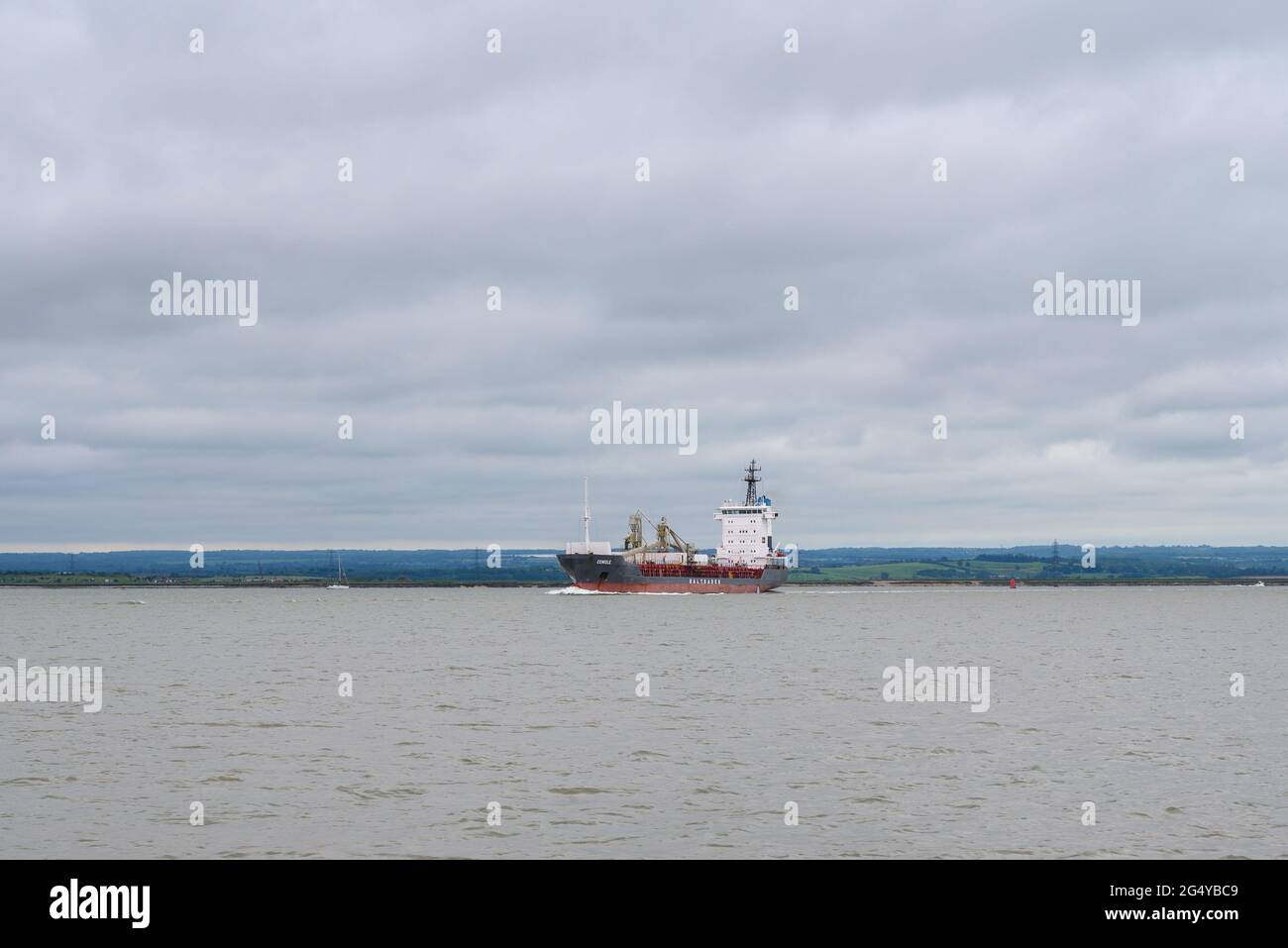 'Cemisle' cement carrier ship, operated by Baltrader, passing Isle of Sheppey on river Medway in the Thames estuary, Kent, England. Stock Photo