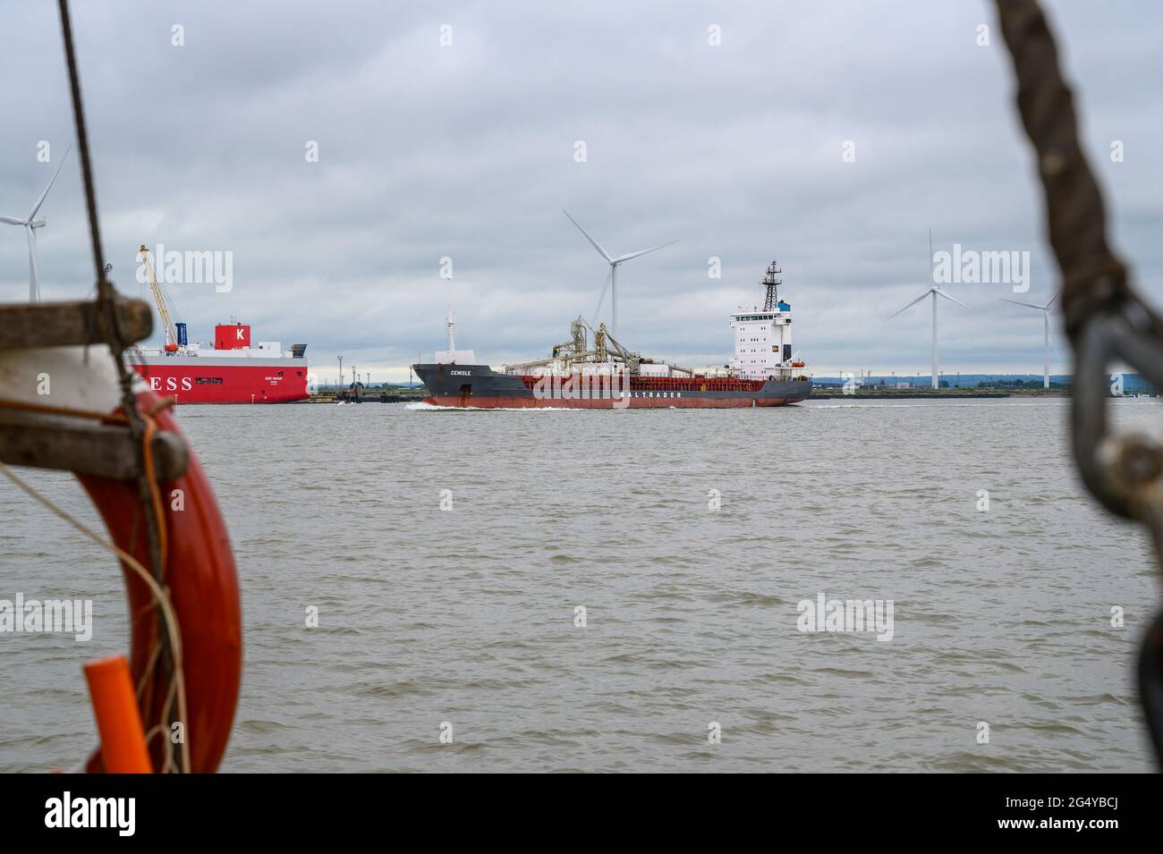'Cemisle' cement carrier ship, operated by Baltrader, passing the port on Isle of Sheppey on river Medway in the Thames estuary, Kent, England. Stock Photo
